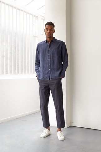 Navy Linen Long Sleeve Shirt Outfits For Men: If you love laid-back outfits, why not test drive this combo of a navy linen long sleeve shirt and navy chinos? Avoid looking overdressed by finishing with a pair of white canvas low top sneakers.