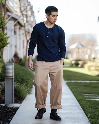 Navy Long Sleeve Henley Shirt Outfits For Men: One of the most popular ways for a man to style out a navy long sleeve henley shirt is to pair it with khaki chinos in a casual look. To add some extra definition to your outfit, introduce black leather casual boots to the equation.