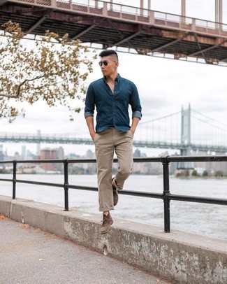 Navy Chambray Long Sleeve Shirt Outfits For Men: Reach for a navy chambray long sleeve shirt and beige chinos to create an interesting and modern-looking relaxed casual outfit. As for shoes, complement your look with a pair of brown leather desert boots.