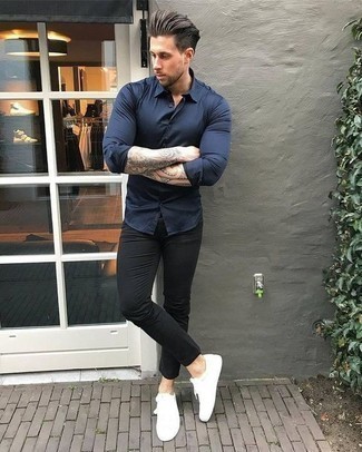 Navy Long Sleeve Shirt Outfits For Men: A navy long sleeve shirt and black chinos are the kind of a winning casual look that you so terribly need when you have no time to put together an outfit. A pair of white leather low top sneakers can instantly dress down an all-too-dressy outfit.