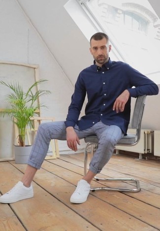Grey Check Chinos Outfits: This combination of a navy long sleeve shirt and grey check chinos offers comfort and utility and helps you keep it low profile yet contemporary. White canvas low top sneakers are the glue that pulls this look together.