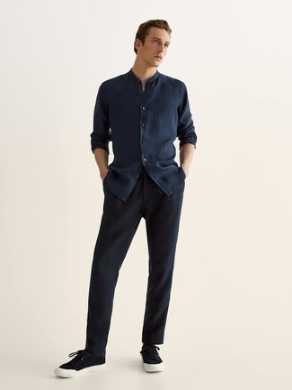 Black Low Top Sneakers with Chinos Casual Outfits: If you're a fan of classic combinations, then you'll love this combination of a navy long sleeve shirt and chinos. A pair of black low top sneakers easily ramps up the fashion factor of this ensemble.