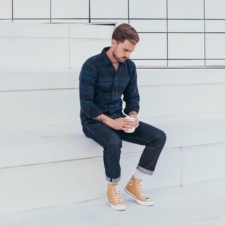 Yellow Canvas High Top Sneakers Outfits For Men: Pair a navy horizontal striped long sleeve shirt with navy jeans for a casual and stylish getup. Complete this ensemble with a pair of yellow canvas high top sneakers to make the outfit more practical.