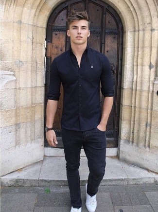Navy Long Sleeve Shirt Outfits For Men: A navy long sleeve shirt and navy jeans are amazing menswear essentials that will integrate brilliantly within your day-to-day off-duty arsenal. White canvas low top sneakers will tie your full ensemble together.