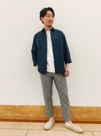 Tan Canvas Espadrilles Outfits For Men: This combination of a navy long sleeve shirt and grey chinos combines comfort and laid-back cool. If in doubt as to what to wear when it comes to footwear, introduce a pair of tan canvas espadrilles to this ensemble.