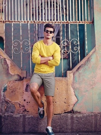 Men's Black Sunglasses, Navy Leather Low Top Sneakers, Grey Shorts, Yellow Crew-neck Sweater