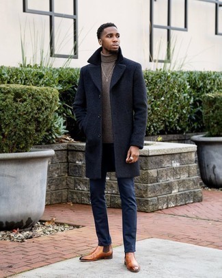 Tobacco Leather Chelsea Boots Outfits For Men: This combination of a navy overcoat and navy chinos is a never-failing option when you need to look casually sleek but have no time to dress up. Let your sartorial skills truly shine by completing this outfit with a pair of tobacco leather chelsea boots.