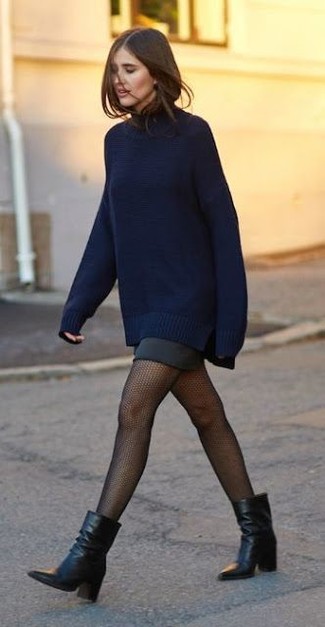 Black Mini Skirt Outfits: A navy oversized sweater and a black mini skirt are wonderful must-haves that will integrate really well within your daily casual lineup. Finishing off with black leather ankle boots is a fail-safe way to introduce some extra oomph to this ensemble.