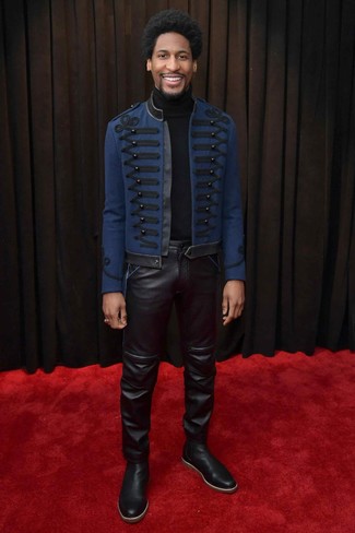 Jon Batiste wearing Navy Embroidered Pea Coat, Black Turtleneck, Black Leather Jeans, Black Leather Chelsea Boots