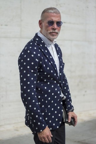 This combo of a navy polka dot blazer and black chinos is definitive proof that a pared down outfit can still be really interesting.