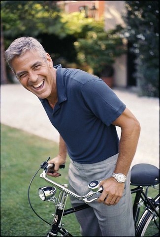 George Clooney wearing Navy Polo, Grey Dress Pants, Silver Watch