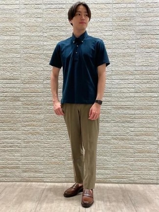 Brown Leather Loafers Outfits For Men In Their 20s: This combo of a navy polo and khaki chinos looks amazing and makes you look instantly cooler. Brown leather loafers are guaranteed to infuse a touch of class into your outfit. This combo should clear any doubts you had about wearing classier clothes as a young man.