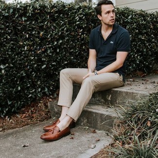 Brown Leather Tassel Loafers Outfits: This ensemble with a navy polo and khaki chinos isn't hard to pull off and is easy to adapt. Brown leather tassel loafers are an easy way to transform your look.