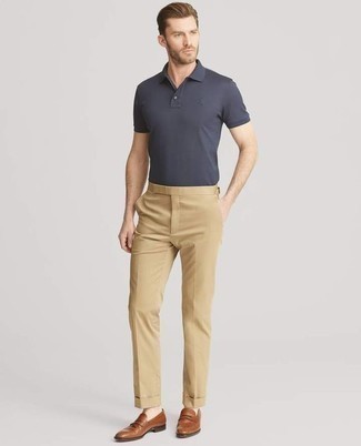 Brown Leather Loafers Outfits For Men: A smart combo of a navy polo and khaki dress pants can keep its relevance in many different circumstances. Bring an added dose of class to this look by rocking brown leather loafers.