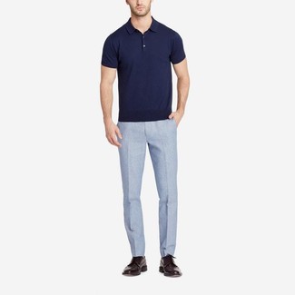 Navy Polo Outfits For Men: Opt for a navy polo and light blue linen dress pants for a proper polished look. On the shoe front, this outfit is complemented perfectly with dark brown leather brogues.