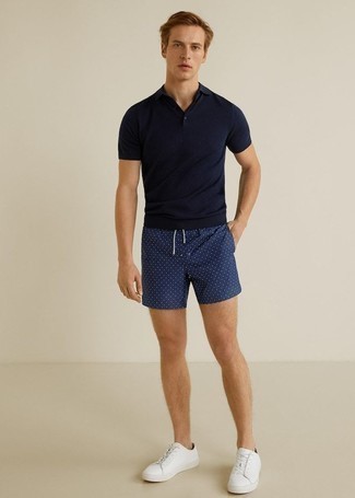 Navy Polka Dot Shorts Outfits For Men: This pairing of a navy polo and navy polka dot shorts is super versatile and really up for whatever's on your itinerary today. A pair of white leather low top sneakers acts as the glue that will bring your ensemble together.