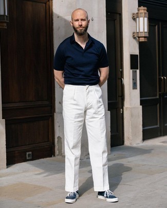 Navy Polo Outfits For Men: This pairing of a navy polo and white chinos is undeniable proof that a straightforward off-duty look doesn't have to be boring. Let your outfit coordination prowess really shine by rounding off this getup with navy and white canvas low top sneakers.