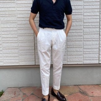 43 Dressy Hot Weather Outfits For Men: Wear a navy polo and white dress pants for a sleek elegant look. A pair of dark purple leather tassel loafers will add a refined aesthetic to the ensemble.