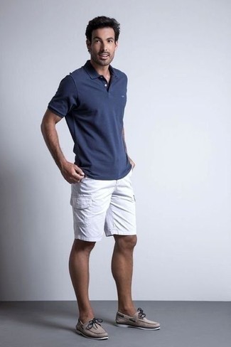 Grey Leather Boat Shoes Outfits: This combination of a navy polo and white shorts is ideal for casual occasions. If you're hesitant about how to finish off, a pair of grey leather boat shoes is a goofproof option.