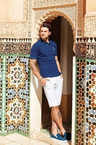 Teal Canvas Slip-on Sneakers Outfits For Men: This pairing of a navy polo and white shorts is hard proof that a straightforward casual outfit can still be extra dapper. Introduce teal canvas slip-on sneakers to the equation and the whole outfit will come together.