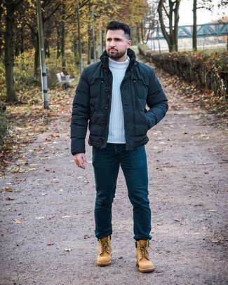 Beige Leather Work Boots Outfits For Men: You're looking at the solid proof that a navy puffer jacket and navy jeans look awesome when paired together. For something more on the daring side to finish your getup, complement your outfit with beige leather work boots.