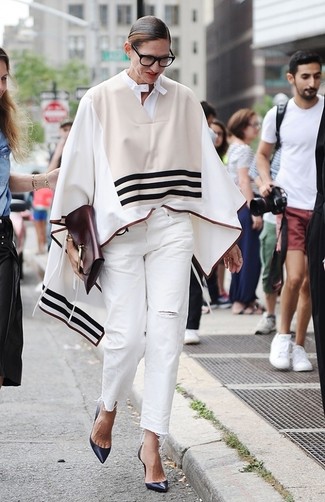 Jenna Lyons wearing Burgundy Leather Clutch, Navy Leather Pumps, White Ripped Jeans, Beige Horizontal Striped Poncho