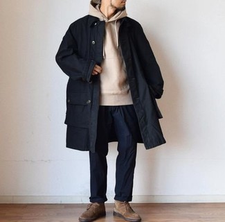 Navy Chinos Outfits: Marry a navy raincoat with navy chinos for an off-duty getup with a fashionable spin. Brown suede desert boots pull the outfit together.