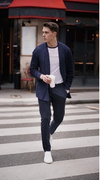 Navy Cardigan Outfits For Men: For an ensemble that's effortlessly smart and camera-worthy, marry a navy cardigan with navy chinos. Finishing off with a pair of white low top sneakers is an effortless way to add a more casual twist to this ensemble.