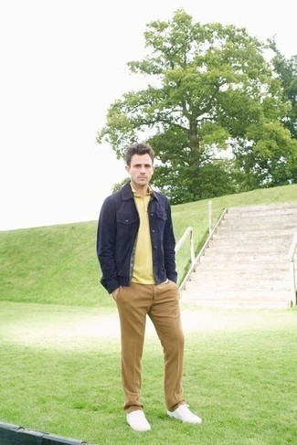 Mustard Polo Outfits For Men: This combination of a mustard polo and khaki chinos is a safe go-to for an effortlessly stylish ensemble. White canvas low top sneakers act as the glue that will bring this ensemble together.