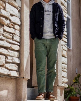 Brown Leather Casual Boots Outfits For Men: A navy shirt jacket and olive chinos are the kind of casually classic pieces that you can wear for years to come. Let your styling savvy truly shine by finishing off this ensemble with brown leather casual boots.