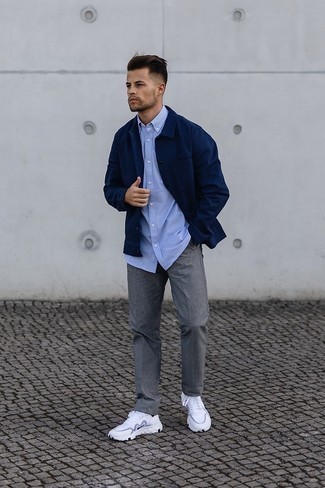 White and Navy Athletic Shoes Outfits For Men: This pairing of a navy shirt jacket and grey vertical striped chinos is effortless, sharp and extremely easy to recreate. Opt for white and navy athletic shoes to make a traditional ensemble feel suddenly fun and fresh.