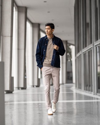 Blue Denim Shirt Jacket Outfits For Men: A blue denim shirt jacket and beige chinos matched together are a perfect match. To give your ensemble a more relaxed finish, complete this ensemble with white canvas low top sneakers.