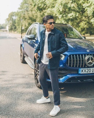 Grey Wool Chinos Outfits: Marrying a navy shirt jacket and grey wool chinos is a surefire way to inject personality into your daily styling arsenal. A pair of white and black canvas low top sneakers instantly turns up the style factor of this look.