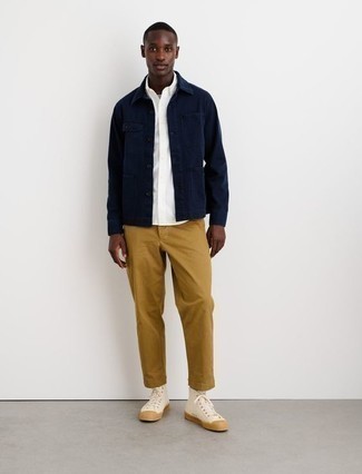 Navy Shirt Jacket Spring Outfits For Men: Marry a navy shirt jacket with khaki chinos if you're aiming for a clean, on-trend ensemble. With footwear, go for something on the casual end of the spectrum by slipping into a pair of beige canvas high top sneakers. This combination is a nice option when spring comes.