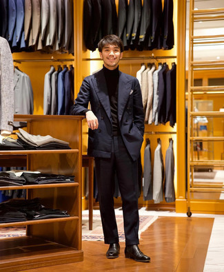 Black Turtleneck Outfits For Men: This combination of a black turtleneck and a navy suit is extra smart and creates instant appeal. Let your styling skills really shine by complementing this outfit with black leather chelsea boots.