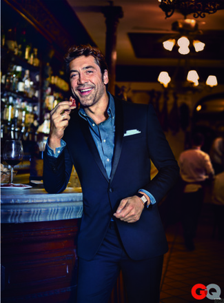 Javier Bardem wearing Navy Suit, Blue Chambray Long Sleeve Shirt, White Pocket Square, Black Leather Watch
