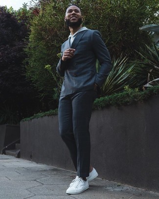 Navy Check Suit Outfits: This combination of a navy check suit and a grey hoodie is an interesting balance between formal and off-duty. Go the extra mile and shake up your getup by finishing with a pair of white canvas low top sneakers.