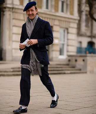 Black and White Gingham Scarf Outfits For Men: This off-duty combo of a navy vertical striped suit and a black and white gingham scarf is a fail-safe option when you need to look casual and cool but have no extra time. Inject a dash of class into your outfit by rounding off with navy leather loafers.