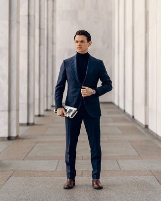 Navy Turtleneck Outfits For Men: When it comes to high-octane class, this combo of a navy turtleneck and a navy suit never disappoints. On the shoe front, this look pairs well with dark brown leather chelsea boots.