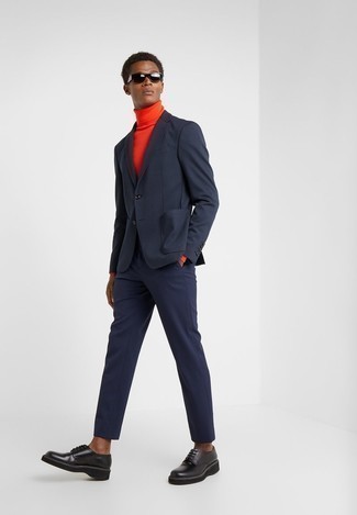Orange Turtleneck Outfits For Men: An orange turtleneck and a navy suit are a polished outfit that every stylish gent should have in his wardrobe. If you're puzzled as to how to finish off, a pair of black chunky leather derby shoes is a surefire option.