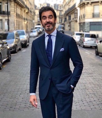 Navy Suit with Dress Shirt Outfits After 50: For a look that's nothing less than camera-worthy, consider wearing a navy suit and a dress shirt. So if you're searching for style inspo for dressing as you move into your 50s, this outfit is perfect.