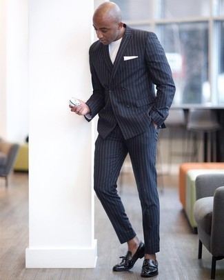 Navy Vertical Striped Suit Outfits: This combination of a navy vertical striped suit and a white crew-neck t-shirt is really a statement-maker. Feeling inventive today? Change things up a bit by finishing off with black leather tassel loafers.