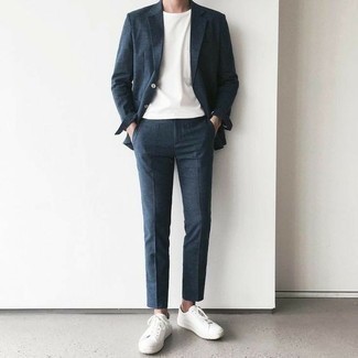 Navy Suit Smart Casual Outfits: A navy suit and a white crew-neck t-shirt matched together are a perfect match. You can get a little creative on the shoe front and play down your look with white canvas low top sneakers.