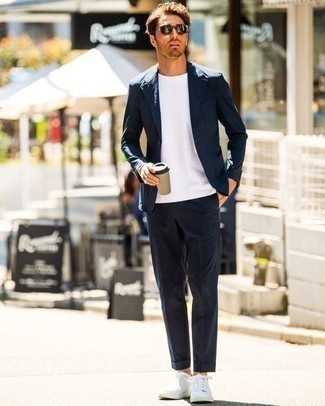White Crew-neck T-shirt with White Leather Low Top Sneakers Smart Casual Outfits For Men: For something on the smart side, opt for a white crew-neck t-shirt and a navy suit. White leather low top sneakers are the simplest way to infuse a dash of stylish effortlessness into your look.