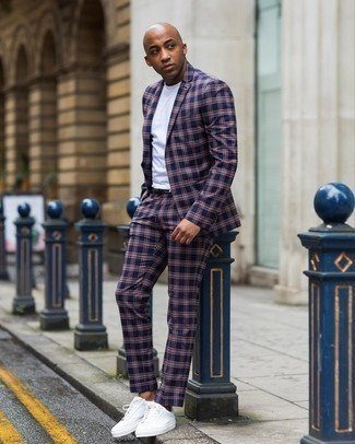 Blue Plaid Suit Outfits: Try teaming a blue plaid suit with a white crew-neck t-shirt and you'll exude rugged elegance and polish. Take your look down a more laid-back path by sporting a pair of white canvas low top sneakers.