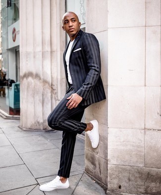 Navy Vertical Striped Suit with White Low Top Sneakers Outfits: When the dress code calls for a classic and casual look, you can easily opt for a navy vertical striped suit and a white crew-neck t-shirt. Take your outfit a more laid-back path by slipping into white low top sneakers.