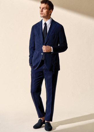 Navy Tie Outfits For Men: Pair a navy corduroy suit with a navy tie for a proper polished getup. Complete this getup with black canvas loafers to keep the ensemble fresh.