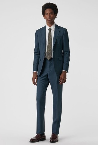 Grey Print Tie Outfits For Men: Putting together a navy suit and a grey print tie is a fail-safe way to infuse masculine elegance into your closet. To inject a more laid-back spin into this ensemble, throw a pair of burgundy leather loafers in the mix.