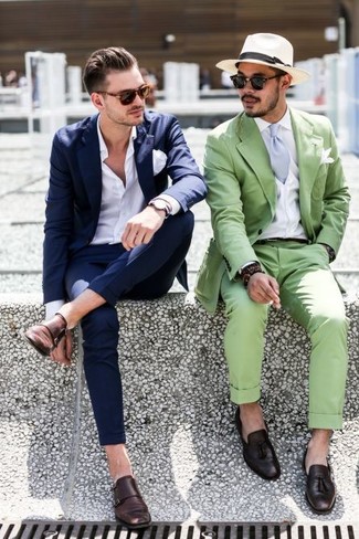 Consider pairing a navy suit with a white dress shirt if you're going for a proper, fashionable outfit. For times when this outfit looks all-too-dressy, dial it down with dark brown leather double monks.