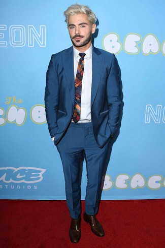 Zac Efron wearing Navy Suit, White Dress Shirt, Dark Brown Leather Oxford Shoes, Multi colored Print Tie